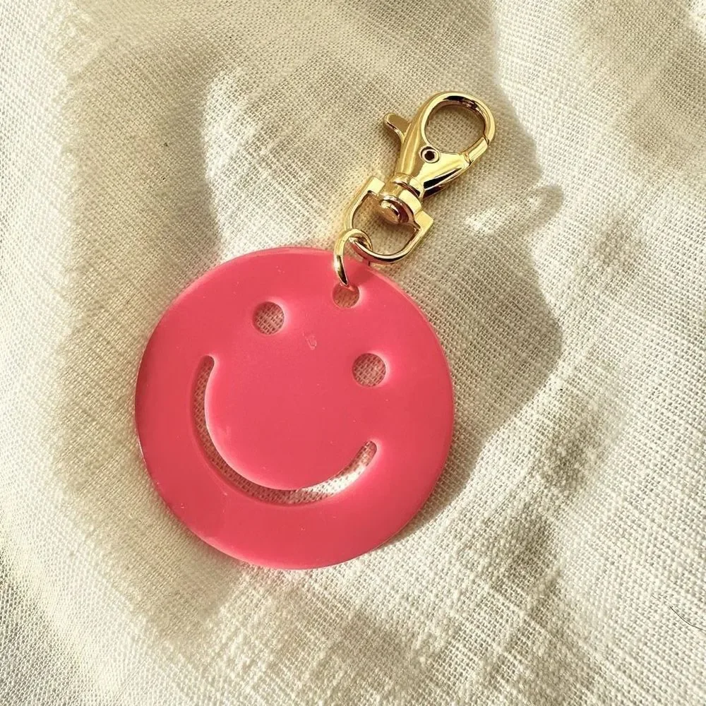 Hot pink smiley face keychain